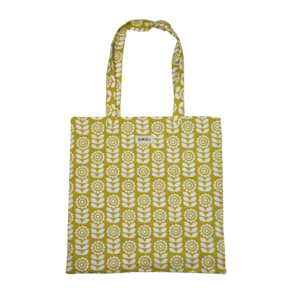 Sac tote bag ou sac banane XL Elness.co avec son motif fleuri et vintage en coton certifié oeko tex. Il a un look très année 70 vintage, très seventies, il est jaune moutarde et blanc écru. Il est fabriqué en France plus précisément en Charente près d'Angoulême.