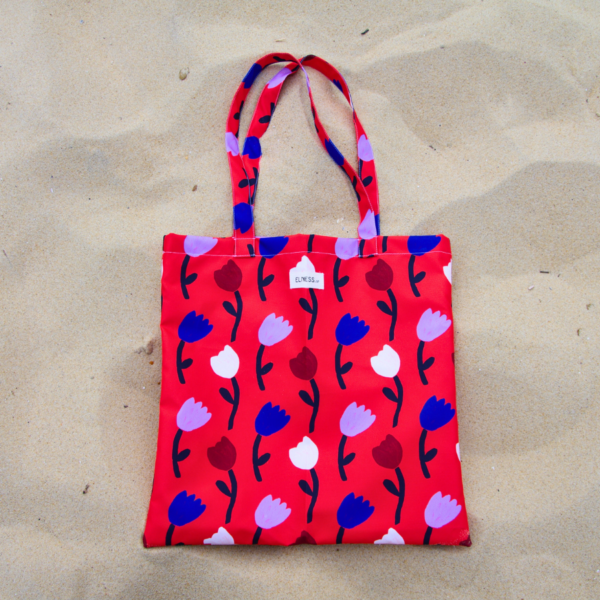 Le tote bag rouge vif elness.co avec des tulipes