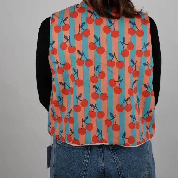 Gilet sans manches unique réversible cerise rayures bleu et pêche